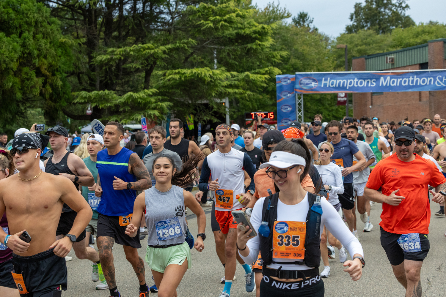 Runners get the Hamptons Marathon started on Saturday morning at Southampton Intermediate School.   RON ESPOSITO