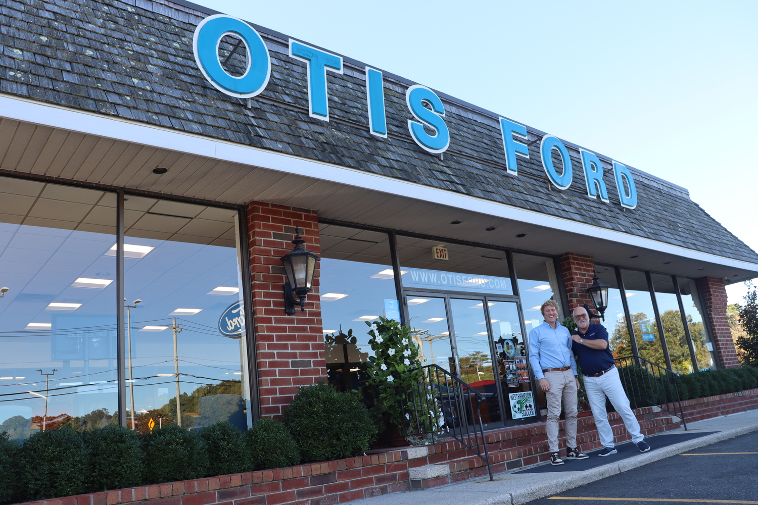 Tom Otis, left, and Stuart Schoener at Otis Ford. Otis Ford acquired Storms Ford and will take over its customer base on the South Fork. CAILIN RILEY