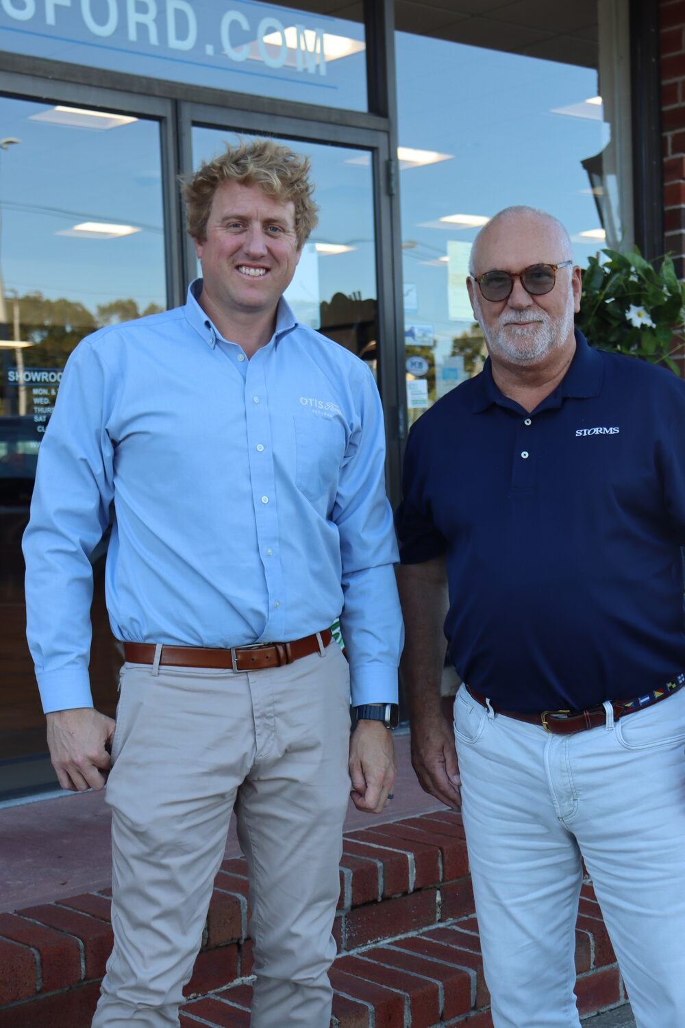 Tom Otis, left, and Stuart Schoener at Otis Ford. Otis Ford acquired Storms Ford and will take over its customer base on the South Fork. CAILIN RILEY