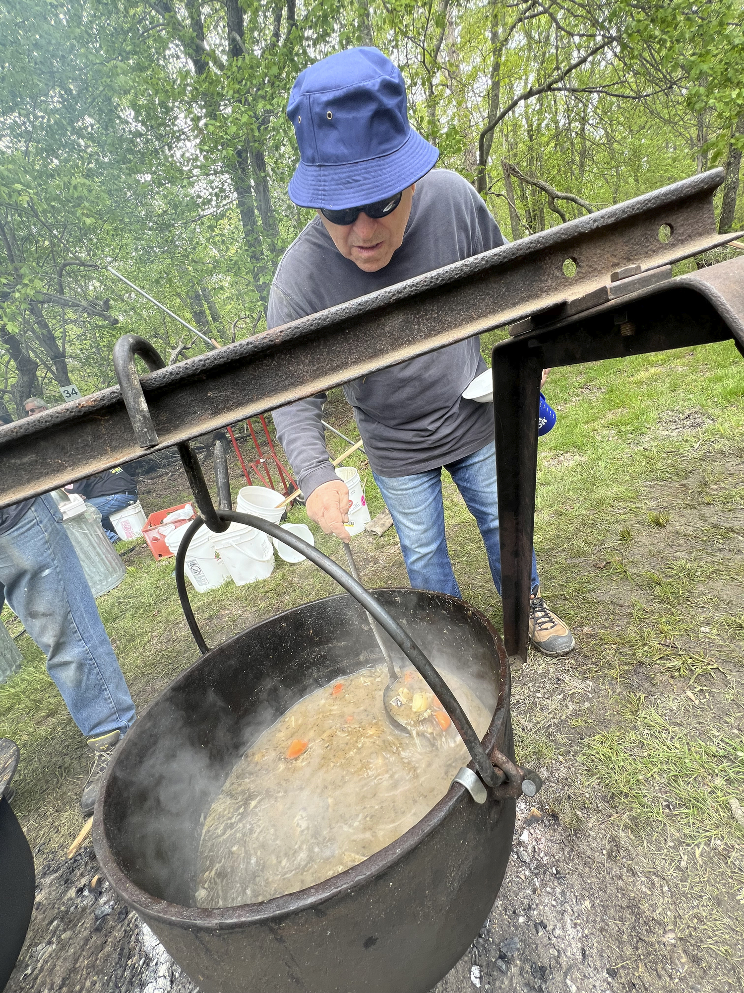 Visitors to the Hunter's Garden sample eel and Manhattan clam chowders cooked in large pots on the site.   DANA SHAW