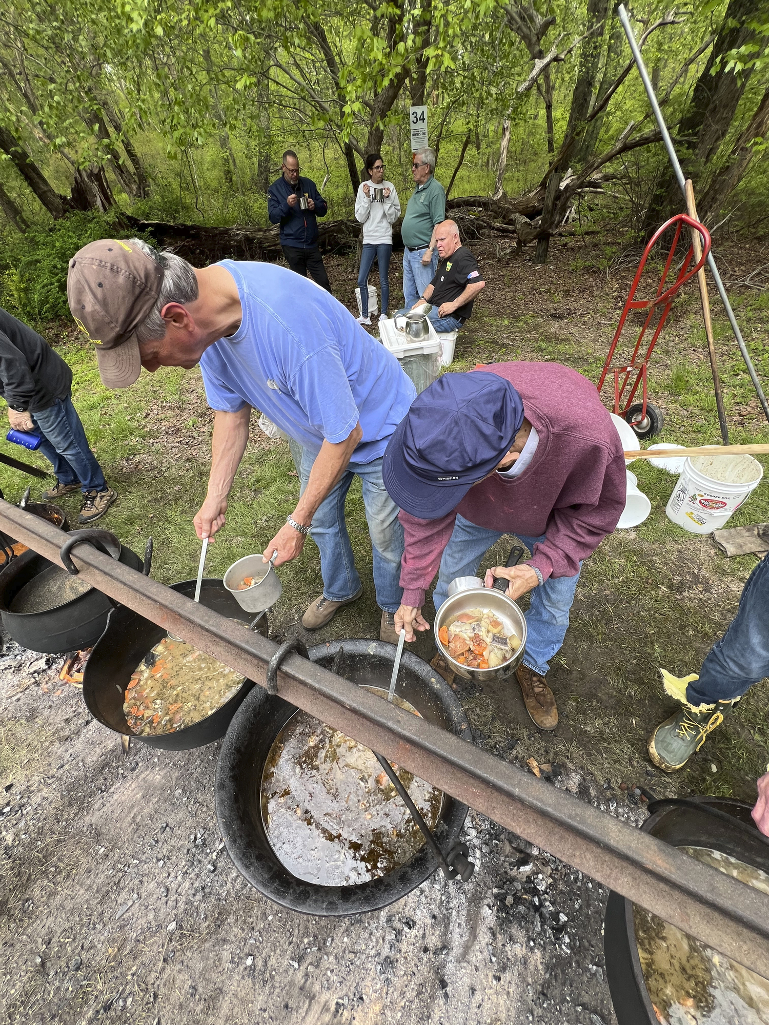 Visitors to the Hunter's Garden sample eel and Manhattan clam chowders cooked in large pots on the site.   DANA SHAW