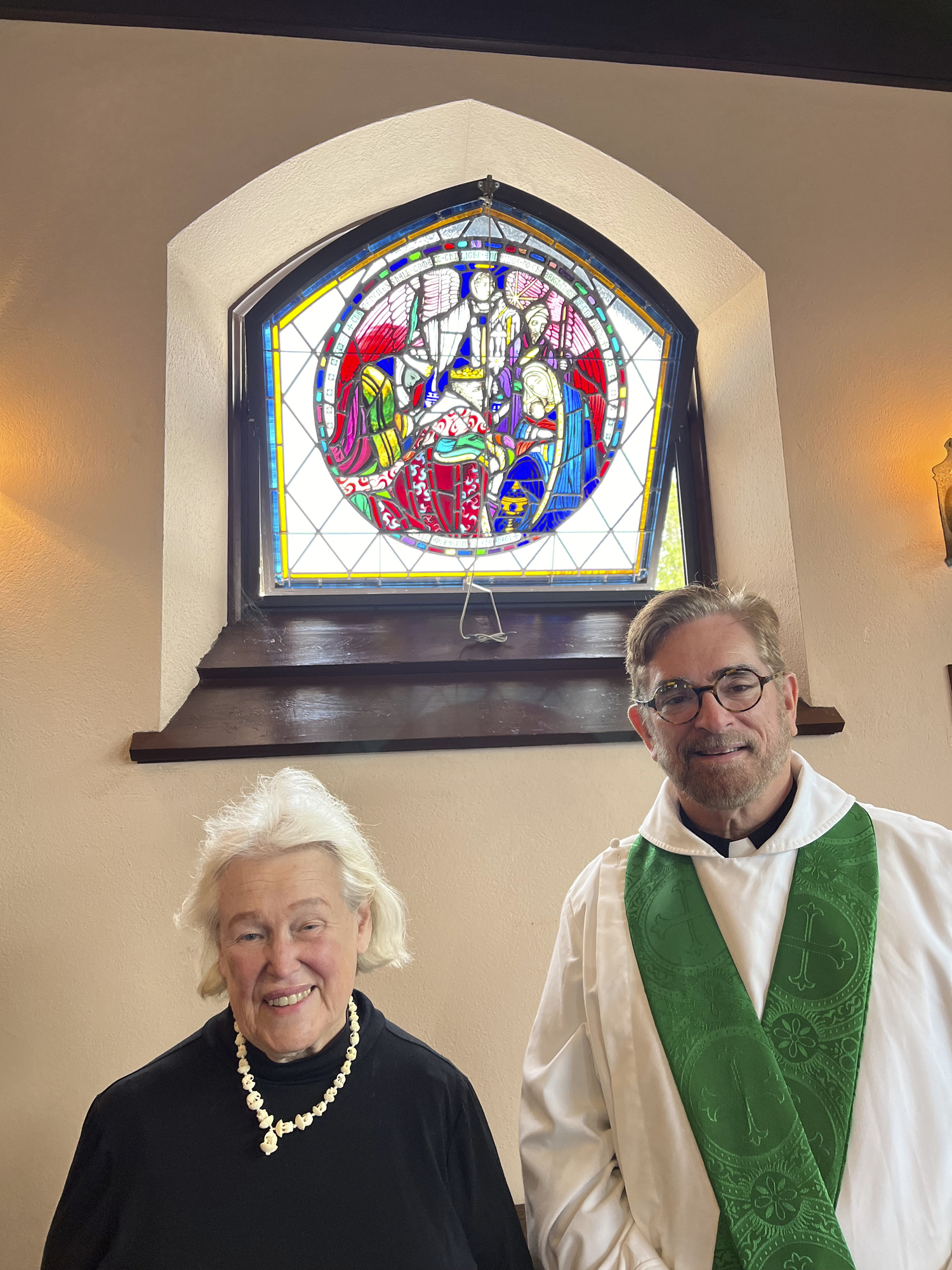 The. Rev. Patrick Edwards and Adele Hall Zachrisson with the Margaret Redmond Windows that she donated in honor of her mother Josephine Dawes Hall and Harold Stanley.  COURTESY ST. JOHN'S ESPICOPAL CHURCH