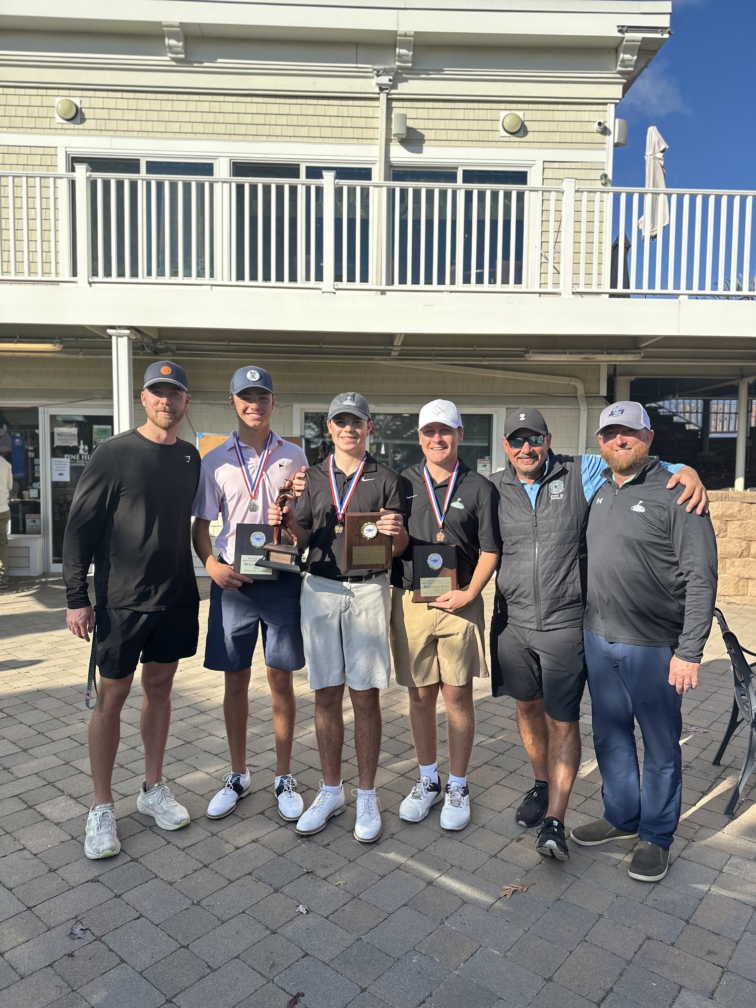 The Hurricanes had a lot to smile about on October 23 when Zach Berger was the county championship, Owen Jessop was runner up and Reid Groth placed sixth to also qualify for states. From left, assistant coach Connor Davis, Owen Jessop, Zach Berger, Reid Groth, head coach Fred Musumeci and assistant coach Terry Moran.   COURTESY JOSH BERGER