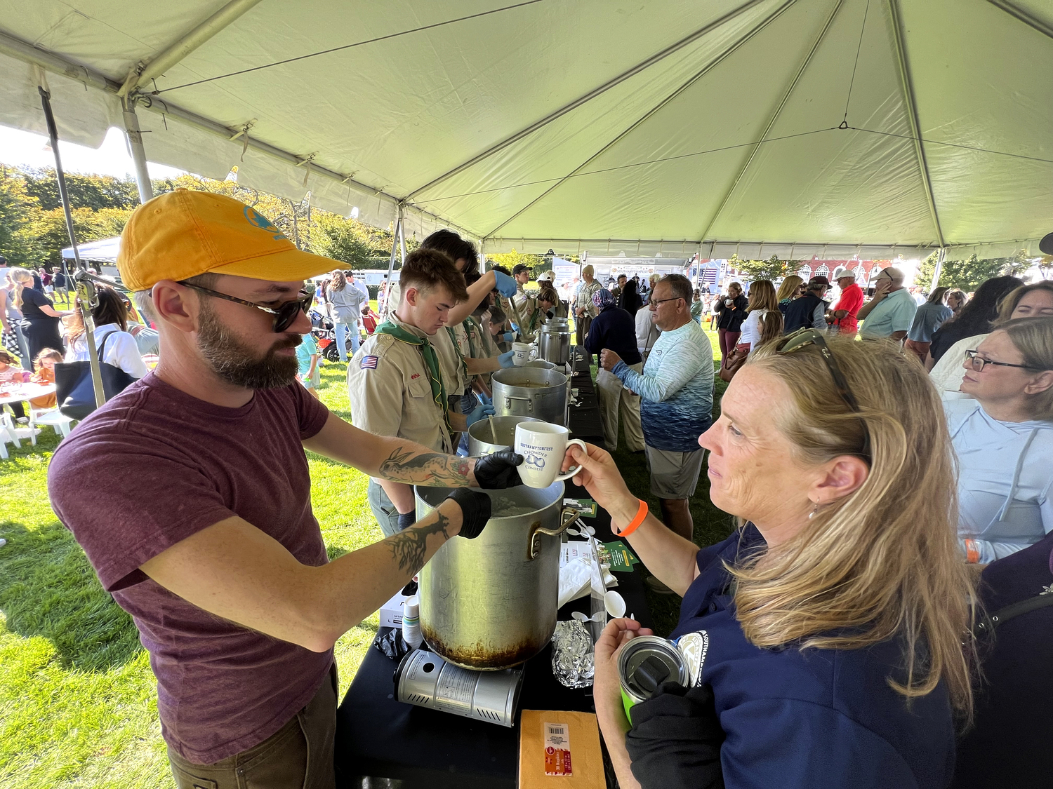 The crowd at SouthamptonFests samples the offering at the chowder contest on Saturday. The Golden Pear was the winner.