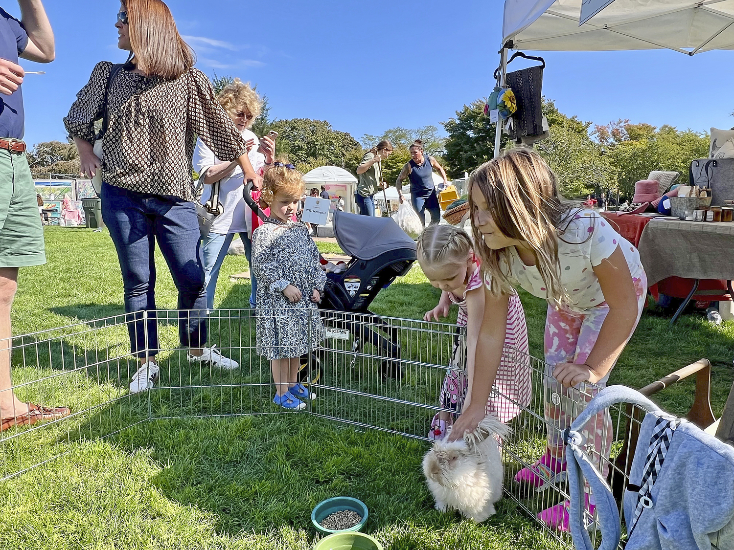 Visitors check out the angora rabbit.