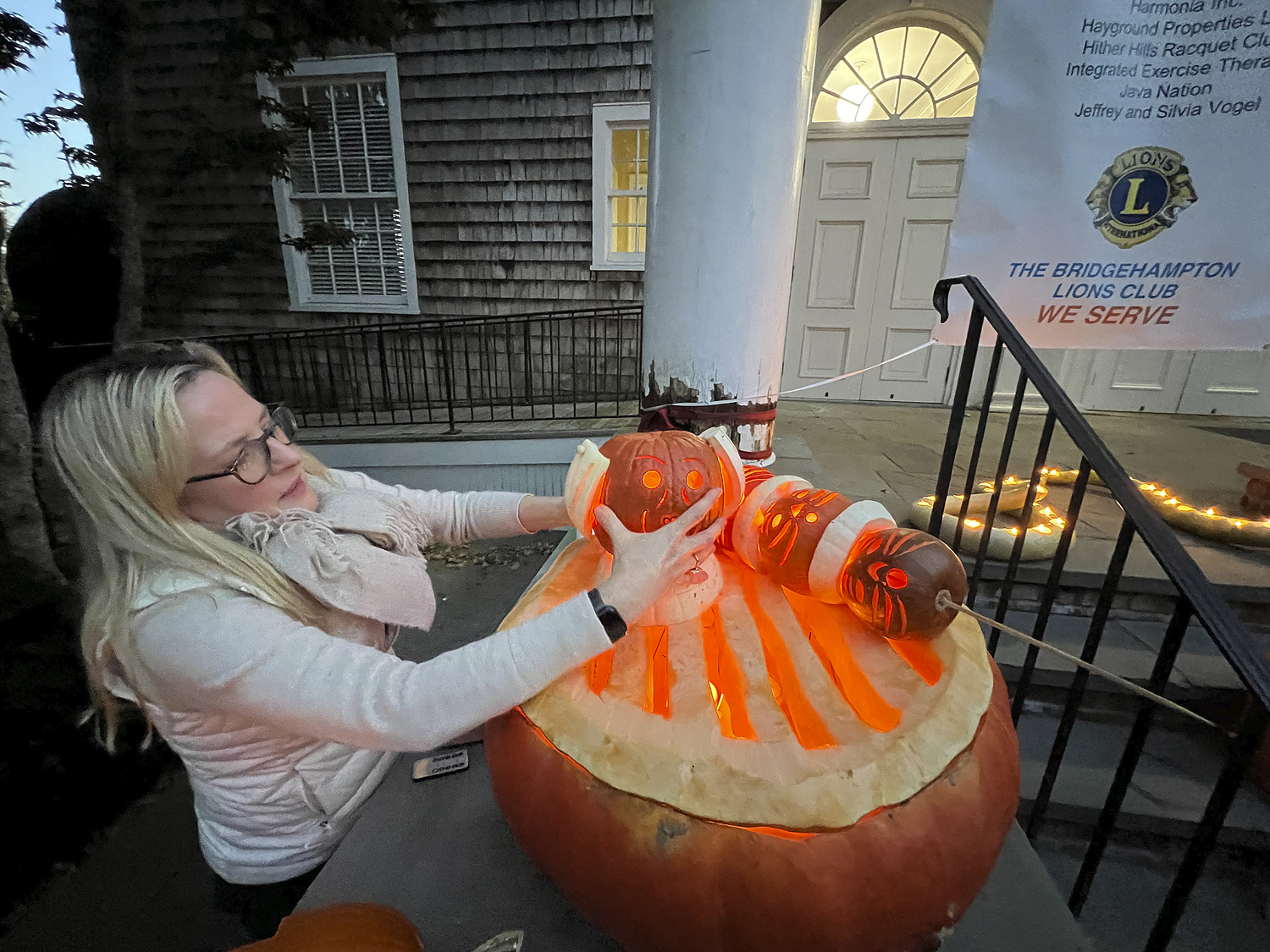 Allison Babcock assembles her Weber Grill, complete with cat kebabs, at the Bridgehampton Lions Club Pumpkin Carving Contest on Monday evening.