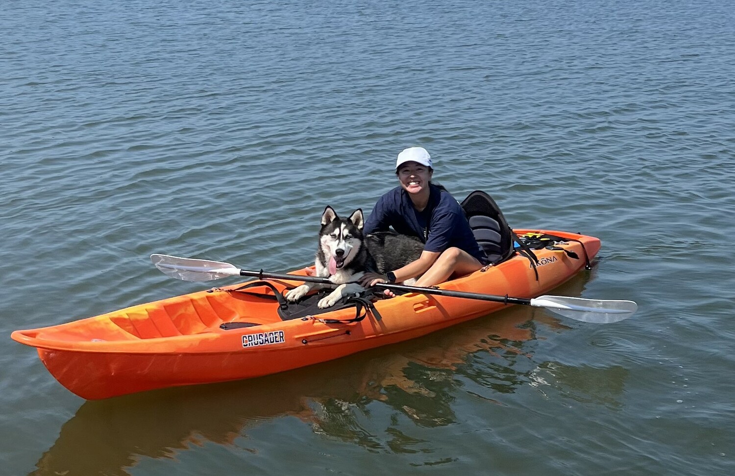 Francesca Johnson kayaks with Reno, one of the shelter's dogs. COURTESY SASF