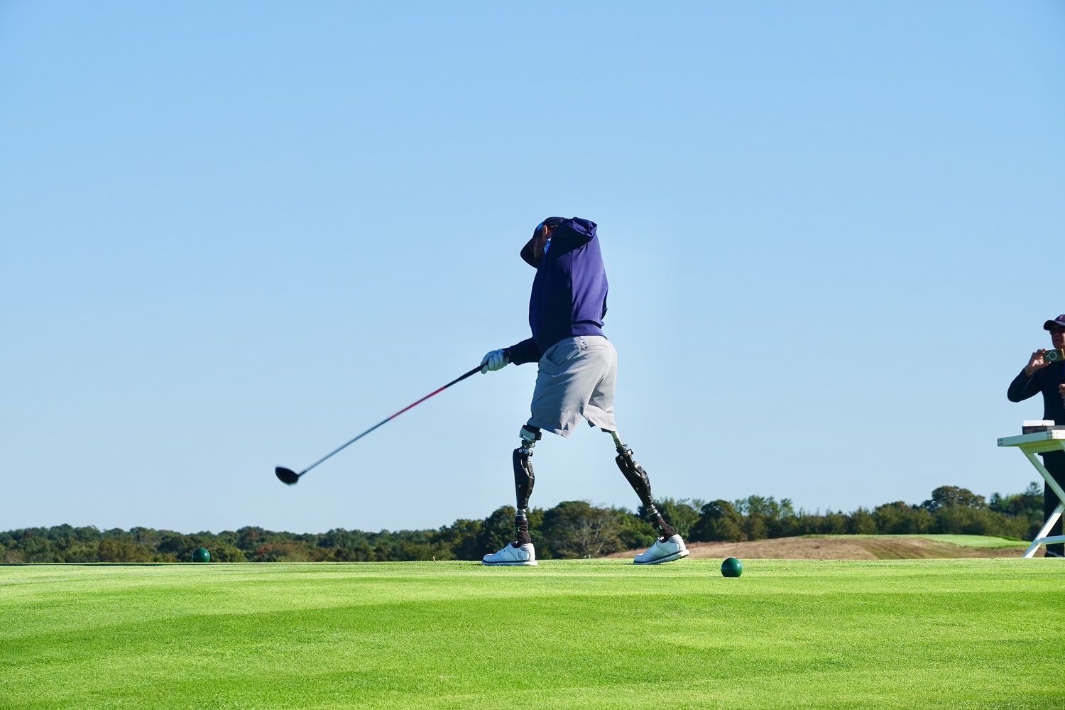 Nick Kimmel, who lost both legs and his left arm in an explosion in Afganistan in 2011, was a expert golfer before his injury and in 2016 taught himself to play swing his clubs with only his right arm. MICHAEL WRIGHT