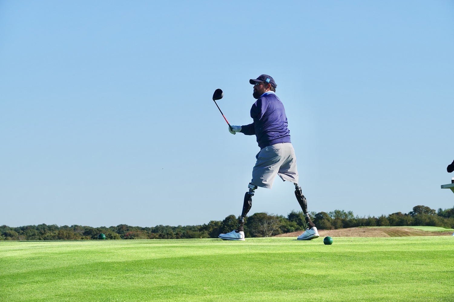 Nick Kimmel, who lost both legs and his left arm in an explosion in Afganistan in 2011, was a expert golfer before his injury and in 2016 taught himself to play swing his clubs with only his right arm. MICHAEL WRIGHT