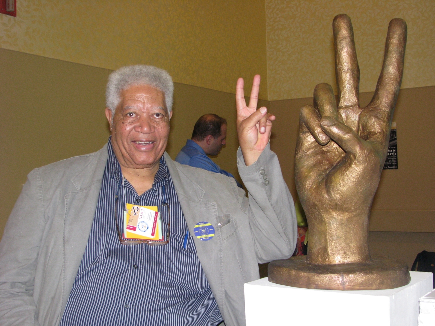 Lucius Ware at the 100th Anniversary NAACP Conference in New York City, posing with a sculpture by artist Dorothy Frankel. COURTESY LISA VOTINO