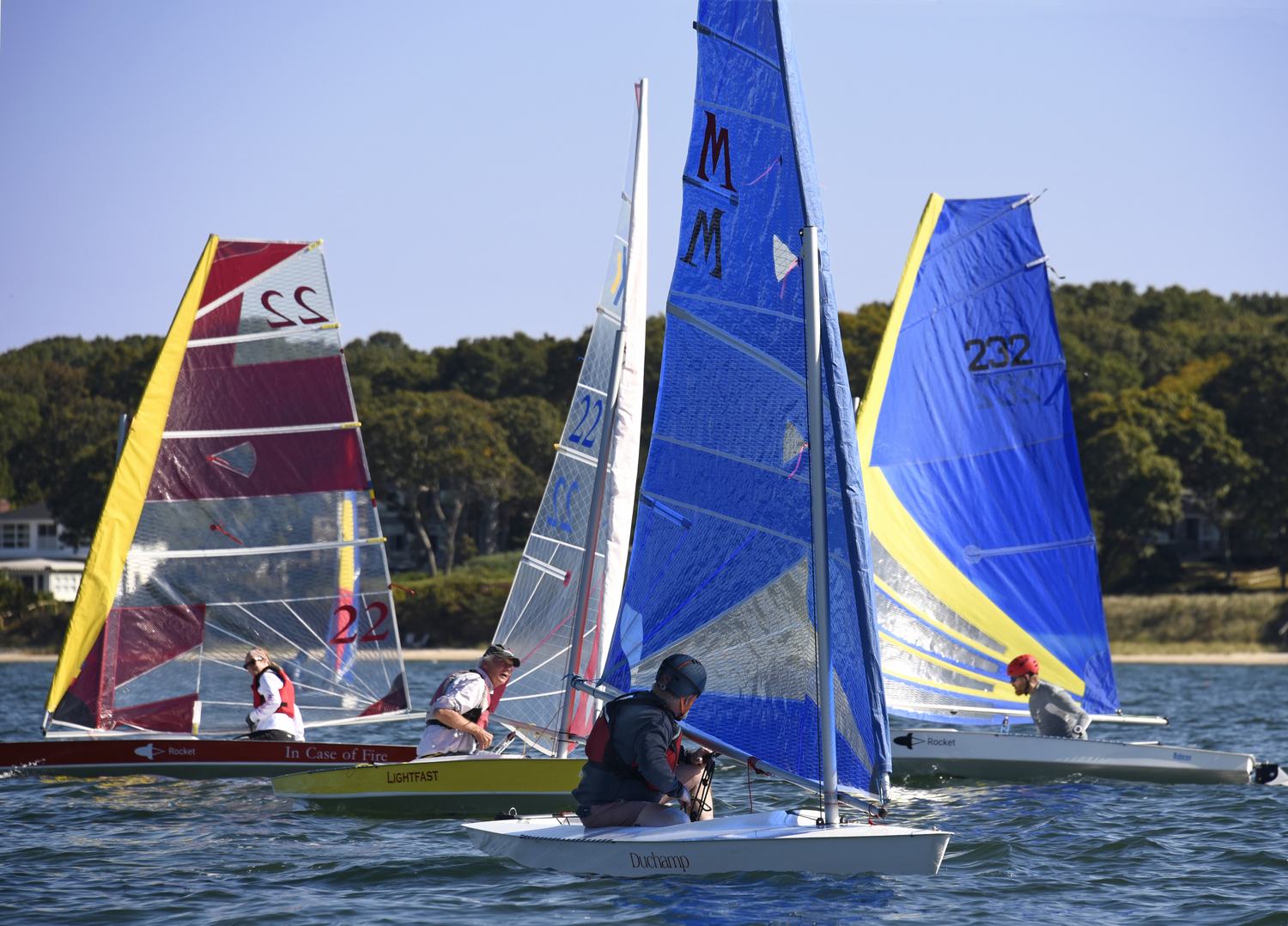 Scott Sandell and Marty Knab in the foreground on privileged starboard tacks slip by port-tackers Barbara-Jo Howard and Mark Webber.   MICHAEL MELLA