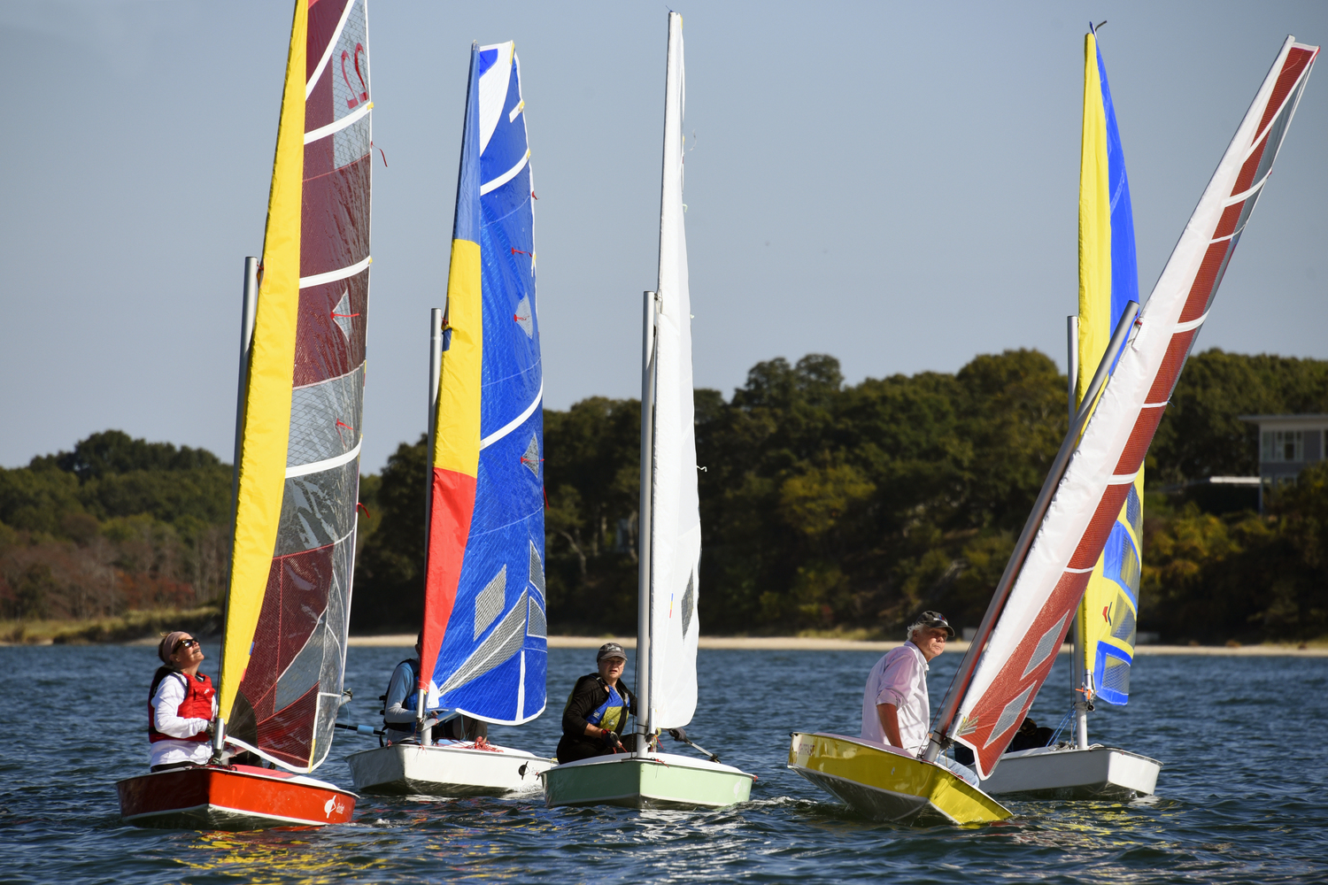 Heading for the weather mark, Barbara-Jo Howard, left, Robert Coles, Gloria Frazee (second place), Scott Sandell (first place) and Mark Webber (third place) fine-tune their sails.   MICHAEL MELLA