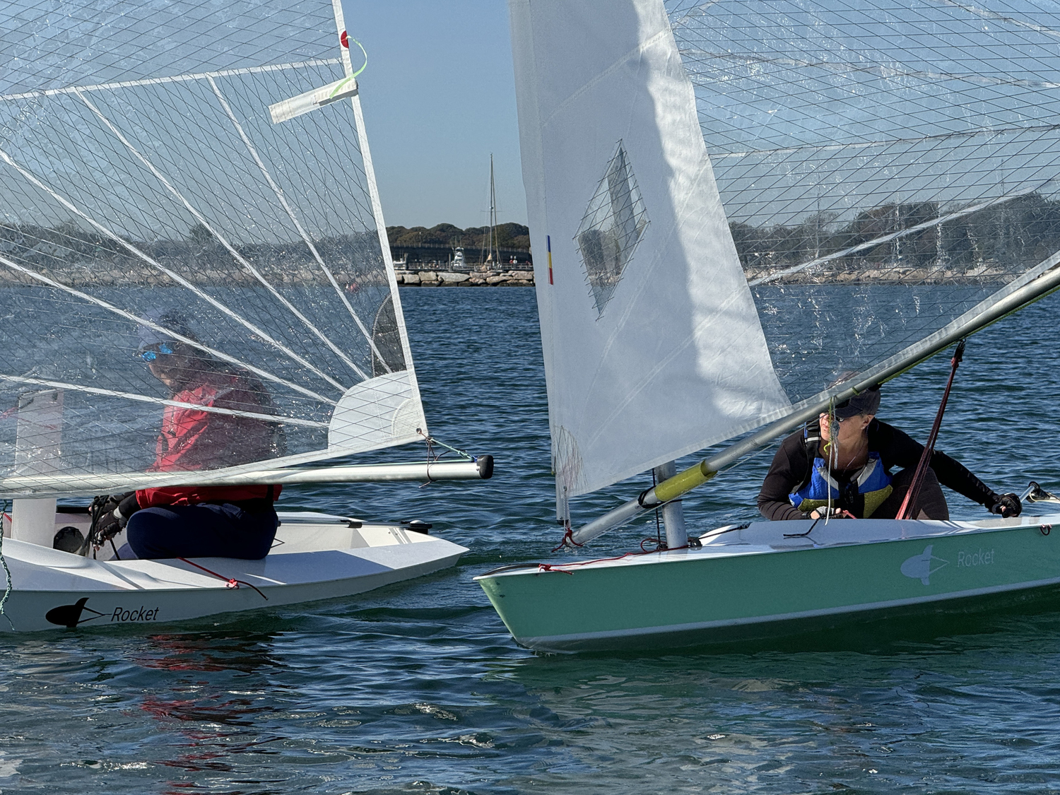 Breakwater Yacht Club Commodore Nick Gazzolo shoots a glance back toward Gloria Frazee as she attempts to pass him to leeward.   MICHAEL MELLA