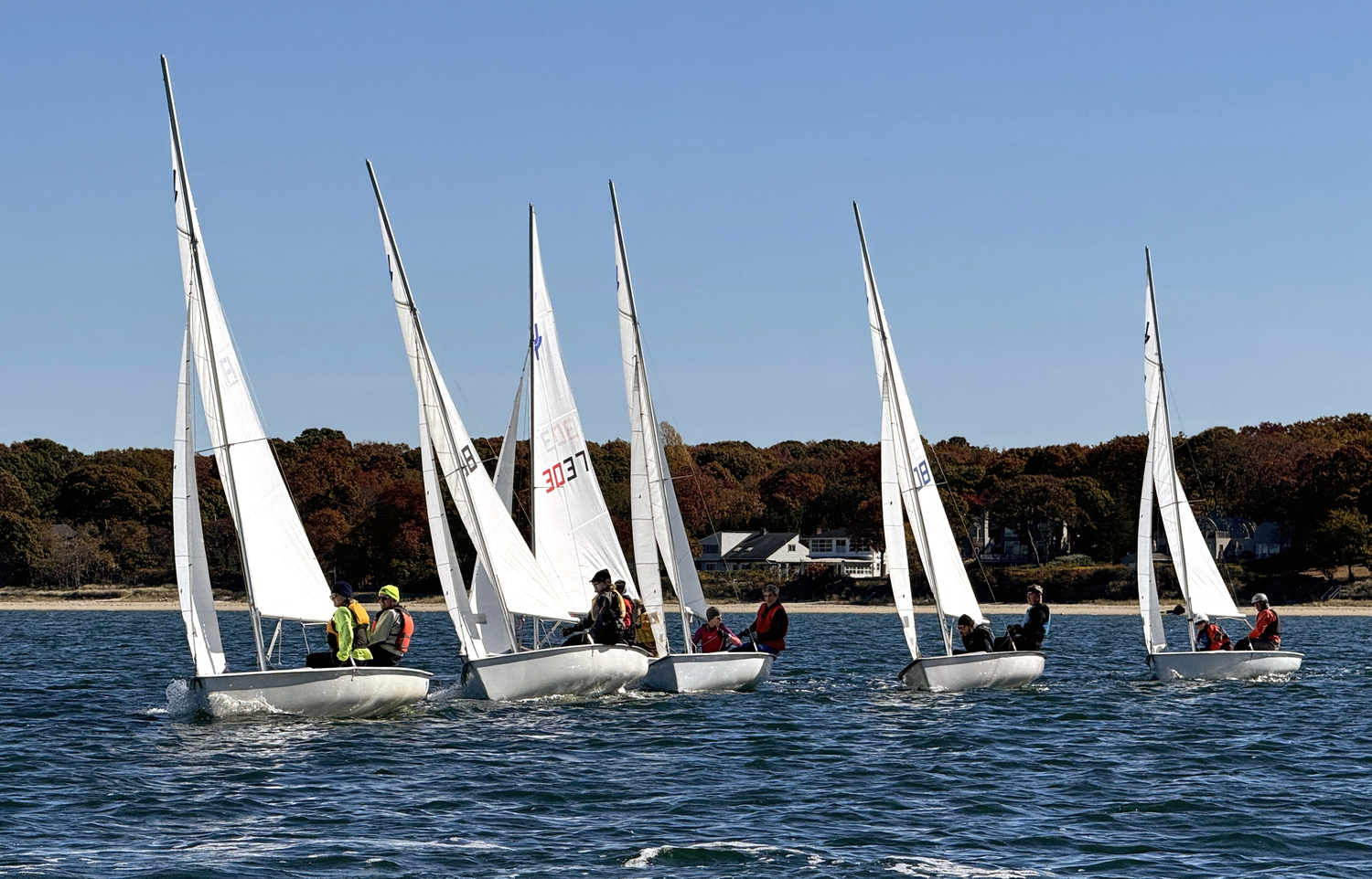 Skipper Lee Oldak and crew Sarah Alford out in front as the fleet beats toward the weather mark a minute after the gun. MICHAEL MELLA