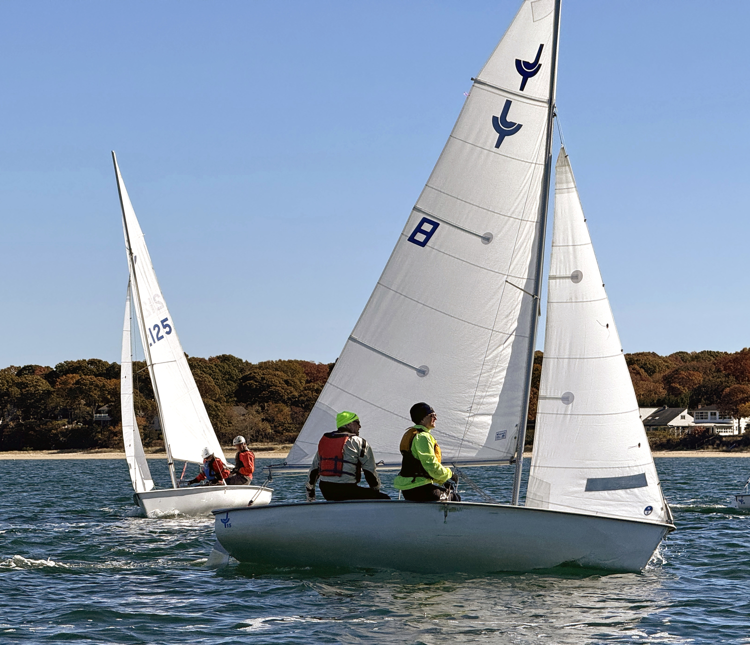 Past BYC commodore Bud Rogers with Jen Theiss “up front” keeping an eye on first place skipper Lee Oldak and skilled headsail trimmer Sarah Alford.  MICHAEL MELLA