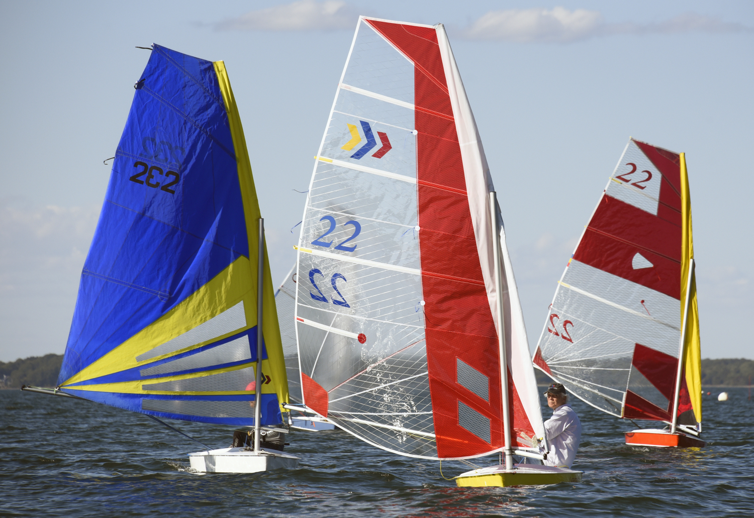 Mark Webber, left, Scott Sandell and Barbara-Jo Howard broad reaching after rounding the jibe mark.    MICHAEL MELLA