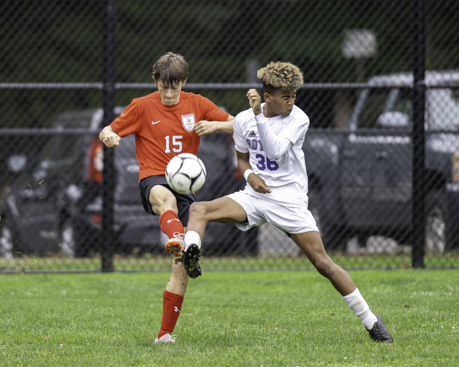 Pierson's Ewen Shannan and a Port Jeff player go for the ball. MARIANNE BARNETT