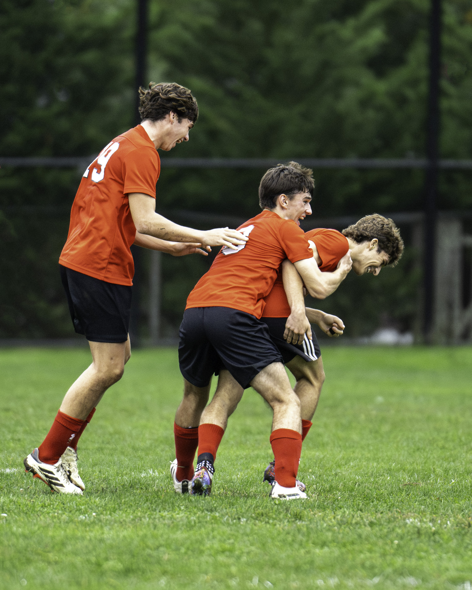 Sebastian Beech and Dylan Knapik mob Steven Ponzini after his corner kick goal tied the game at 1-1 in the first half of last week's home against Port Jefferson.   MARIANNE BARNETT