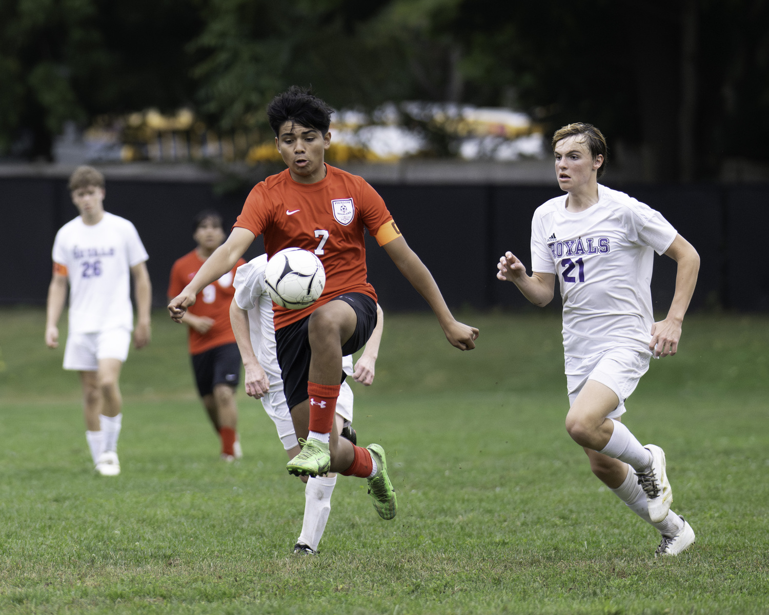 Pierson senior Wilmer Reyes plays the ball with his knee.   MARIANNE BARNETT