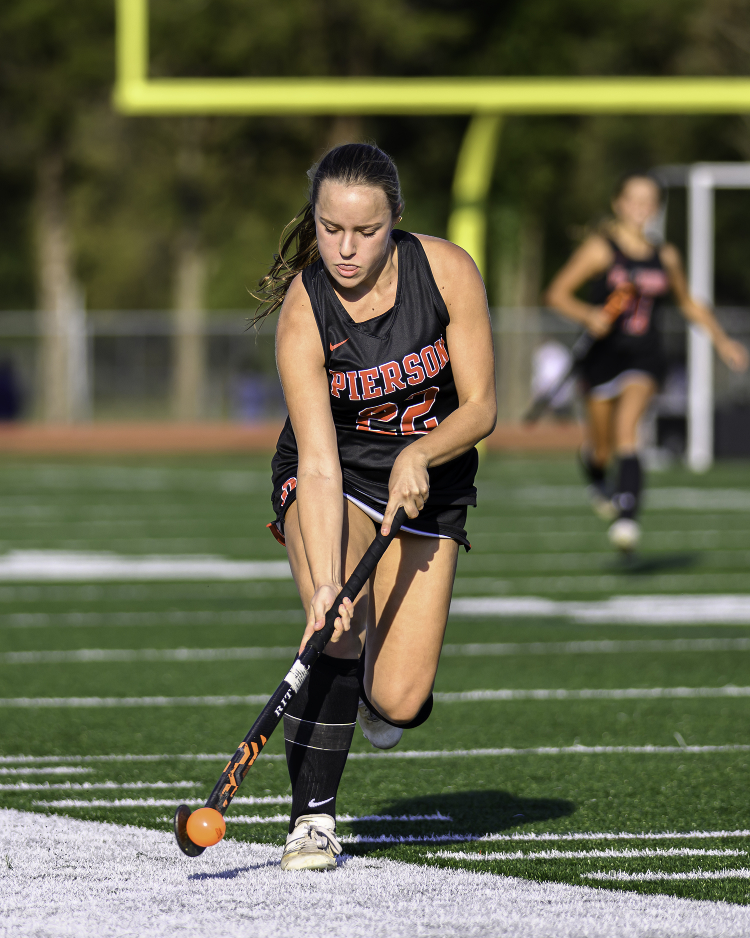 Pierson senior Bella Eldridge moves the ball down the field on her stick.   MARIANNE BARNETT