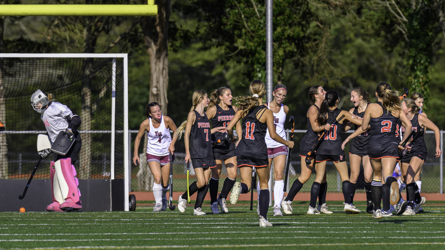 The Whalers celebrate the first goal of the game by Shelby Casey.   MARIANNE BARNETT