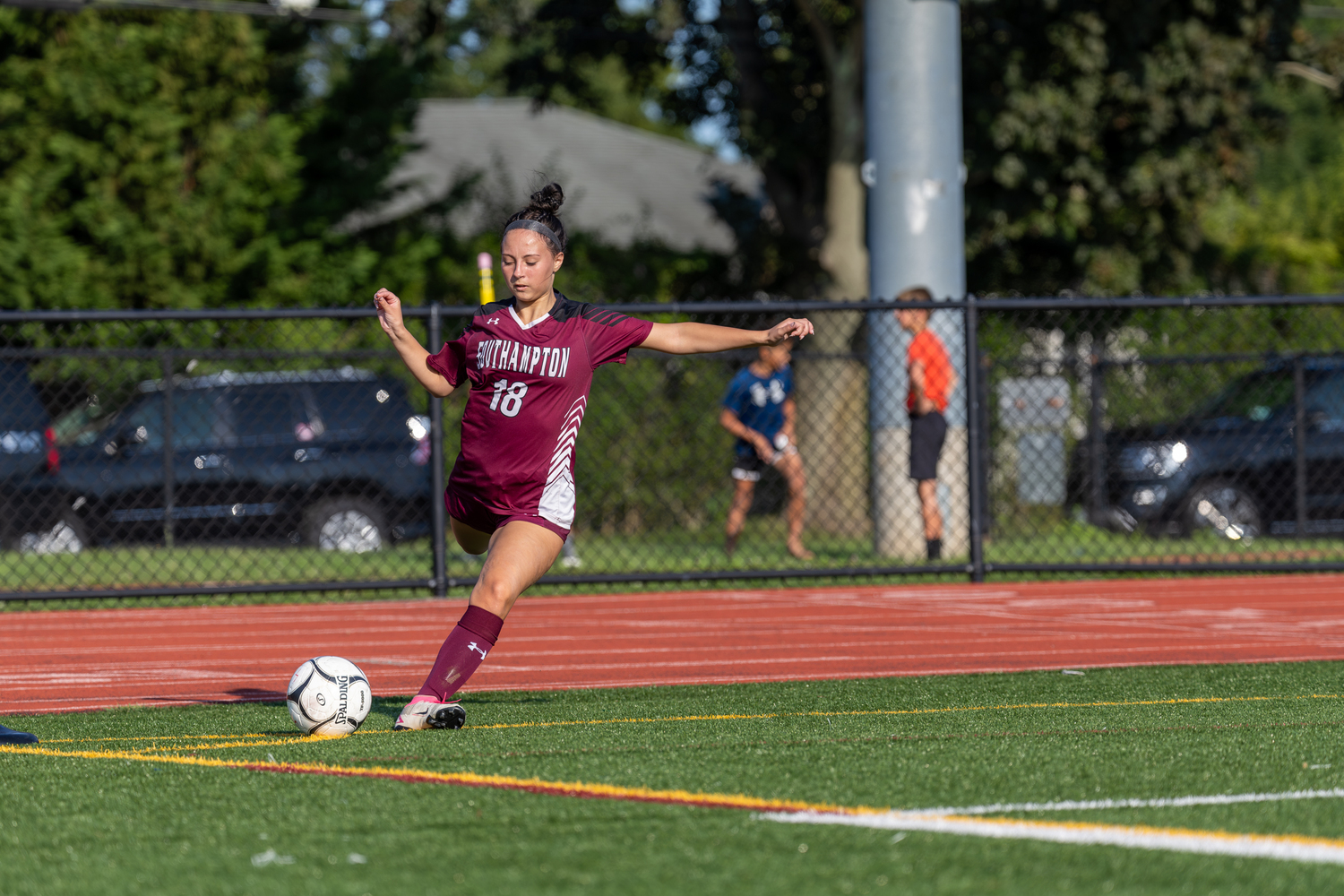 Senior Anabella Fischette takes a corner for the Mariners.