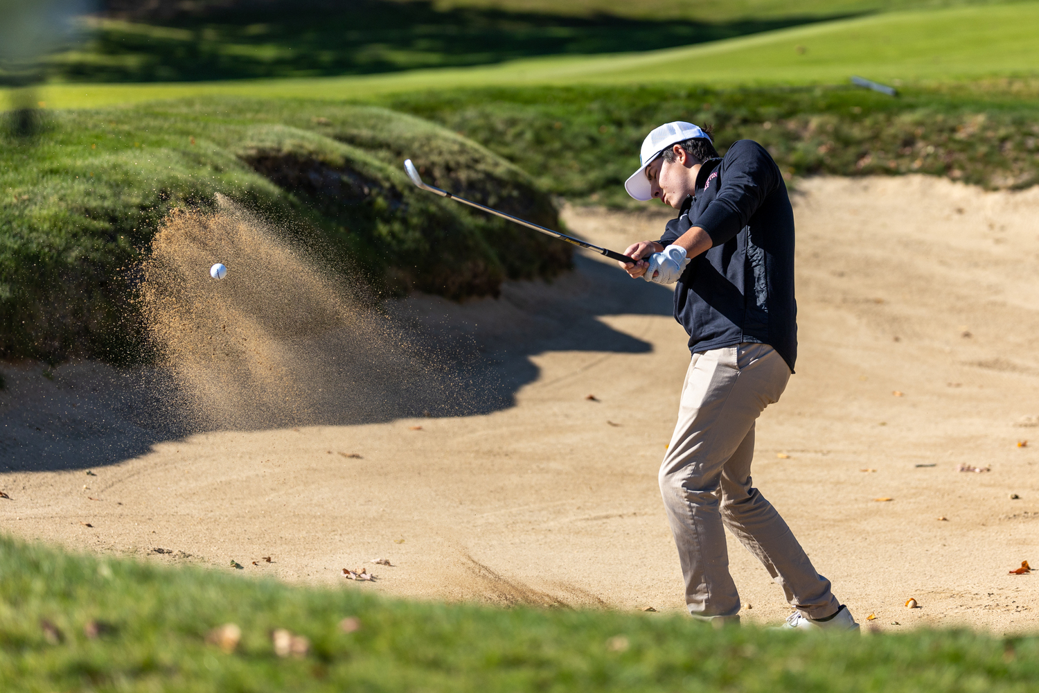 Southampton junior Colin DiLalio tries to get himself out of a bunker.  RON ESPOSITO