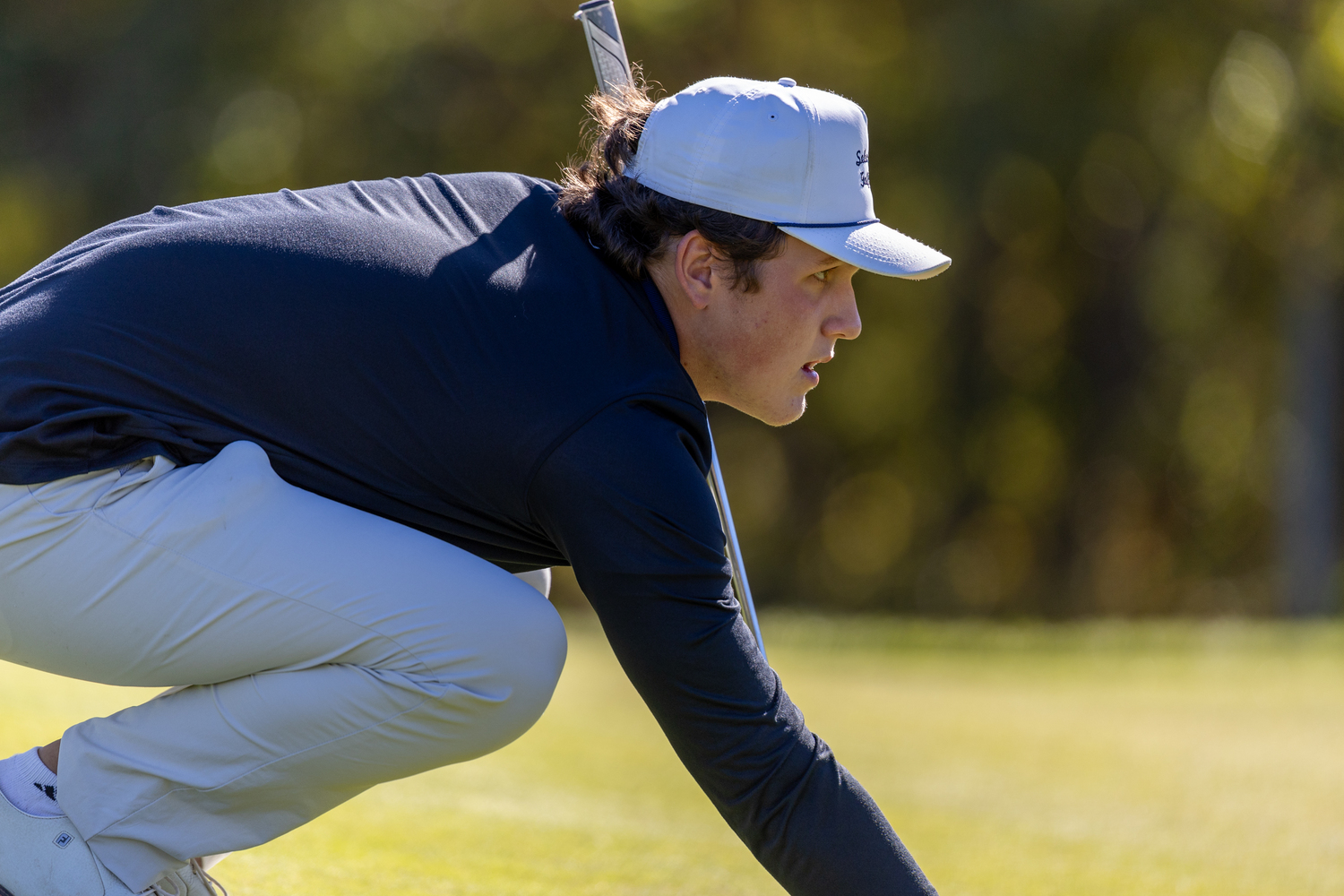 Southampton junior Ethan Heuer lines up a putt.   RON ESPOSITO