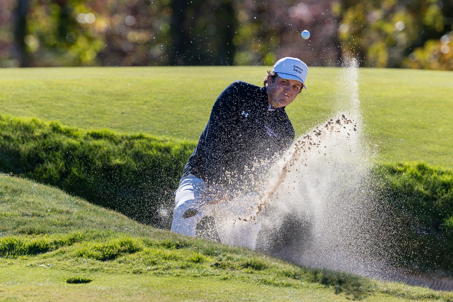 Southampton junior Ethan Heuer tries to get himself out of a sand trap.  RON ESPOSITO