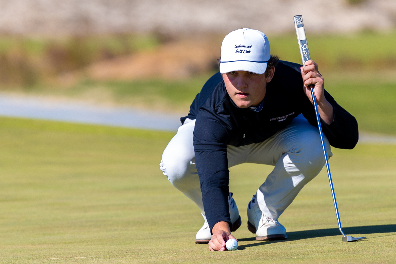 Southampton junior Ethan Heuer lines up a putt.   RON ESPOSITO