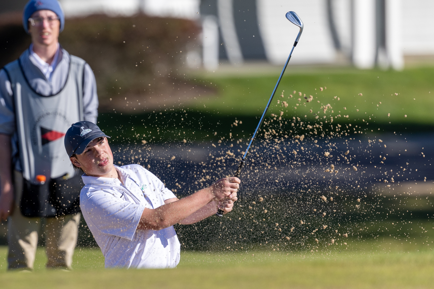 Westhampton Beach junior Zach Berger tries to get himself out of a sand trap.  RON ESPOSITO