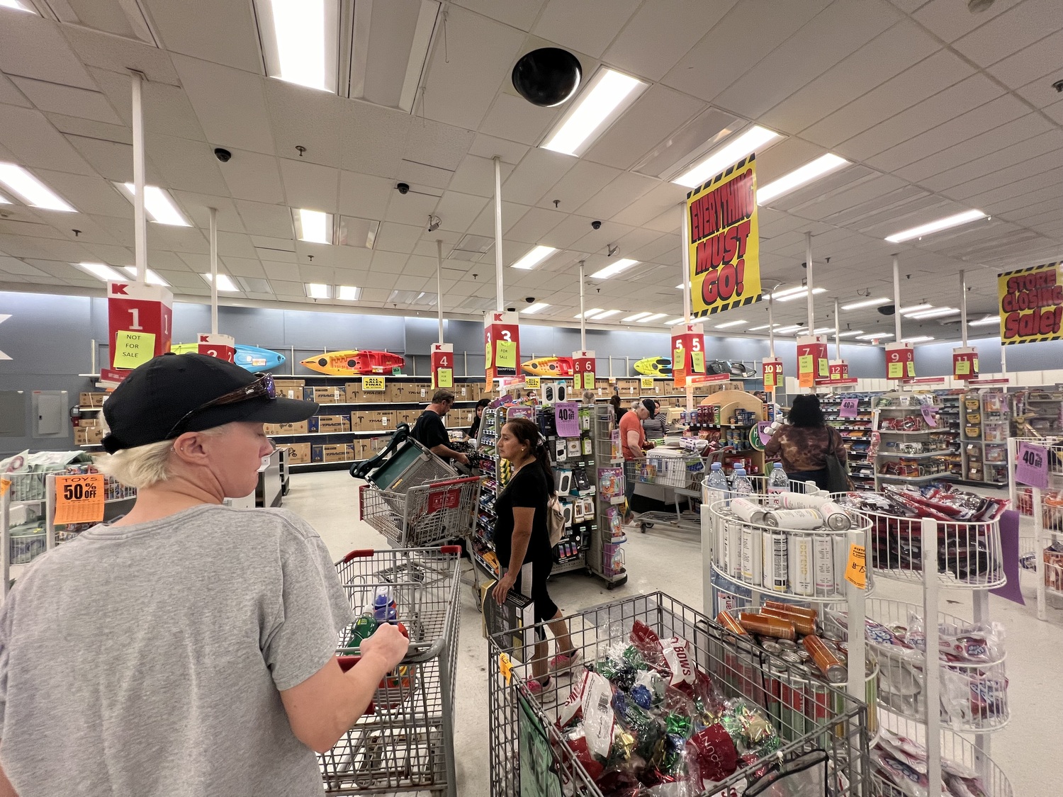 Shoppers wait to check out at the Kmart in Bridgehampton Commons, which will close this week. DANA SHAW PHOTOS