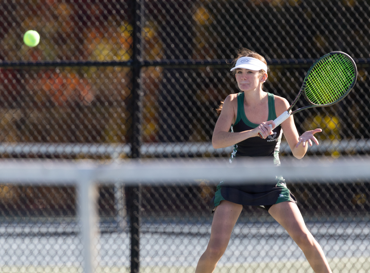 Sophomore Ava Borruso returns a serve. RON ESPOSITO