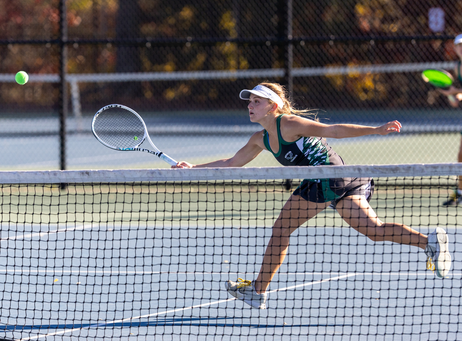 Senior Matilda Buchen crosses the court for a volley. RON ESPOSITO