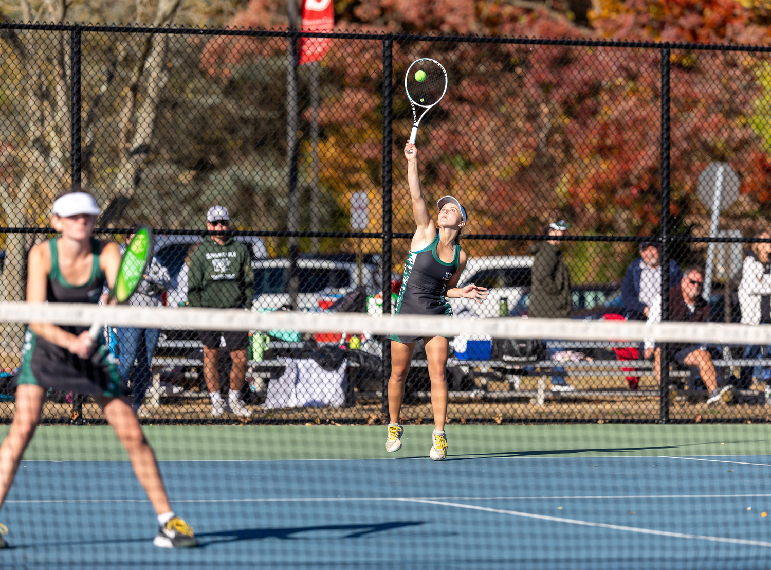 Senior Matilda Buchen serves. RON ESPOSITO