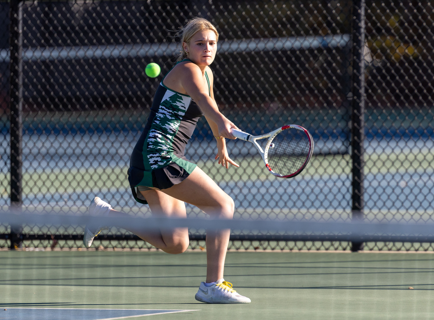 Senior Shannon Killoran reaches for a backhand return. RON ESPOSITO