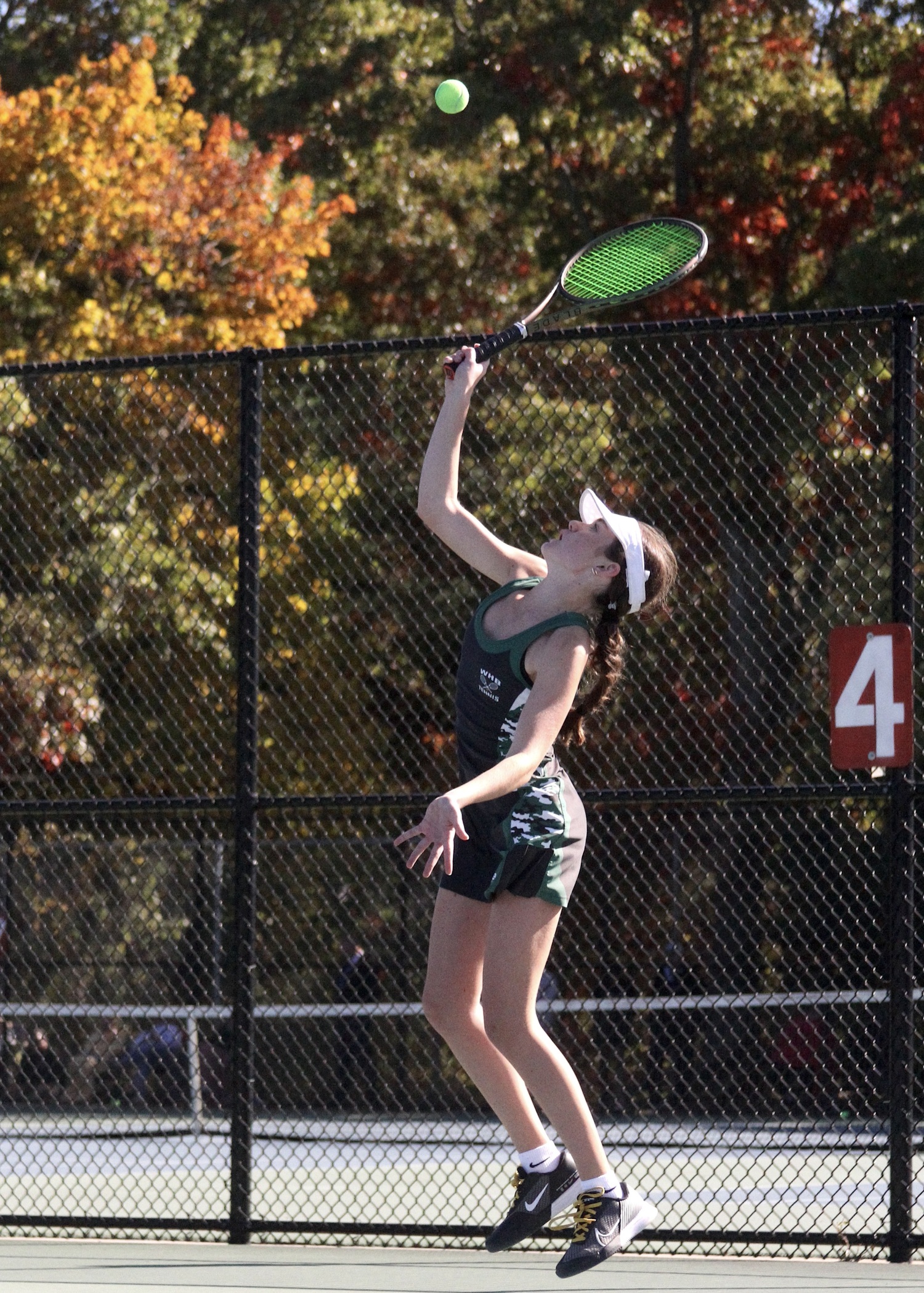 Freshman Ava Borruso serves. DESIRÉE KEEGAN