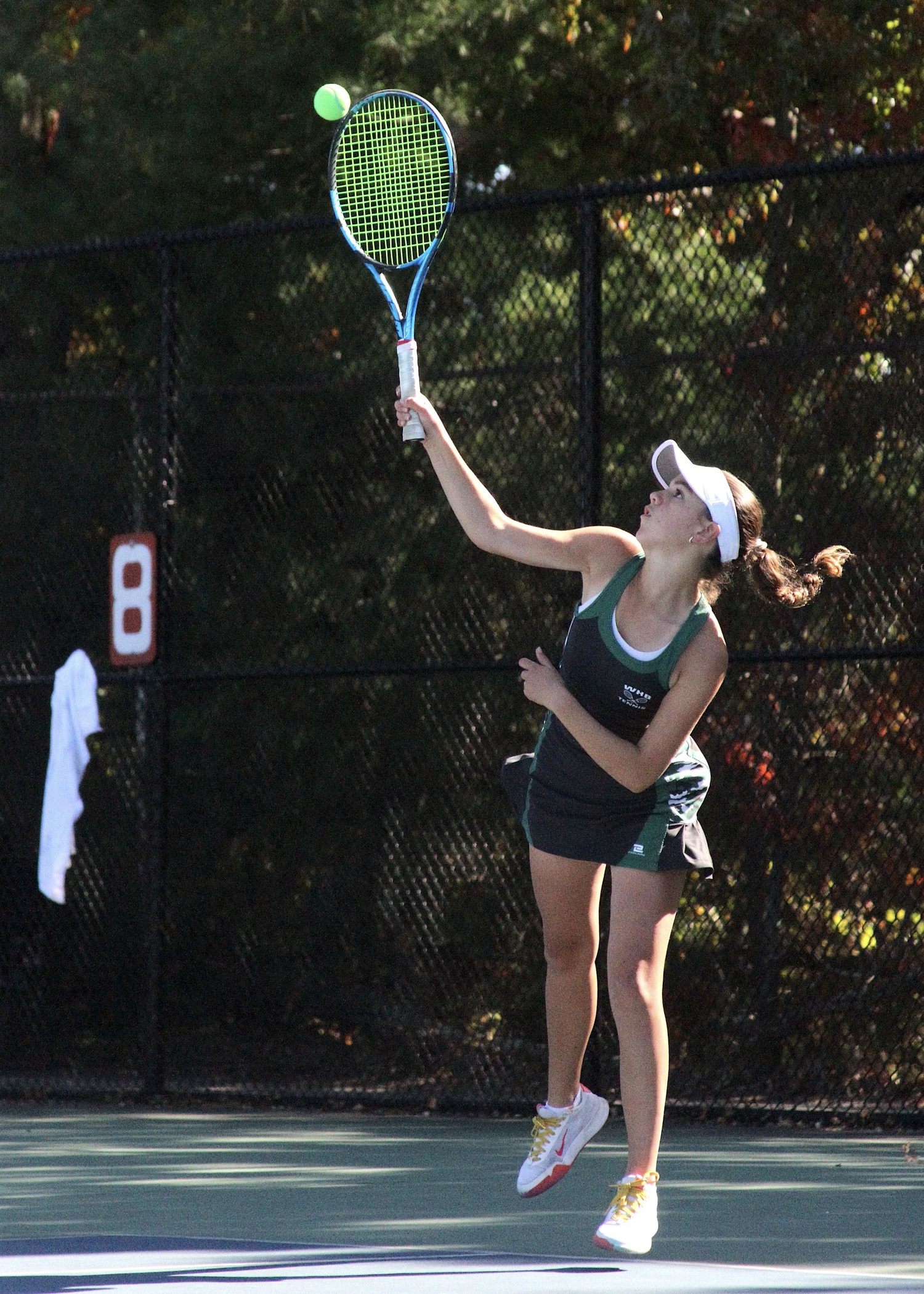 Eight-grader Gabby Arango serves. DESIRÉE KEEGAN