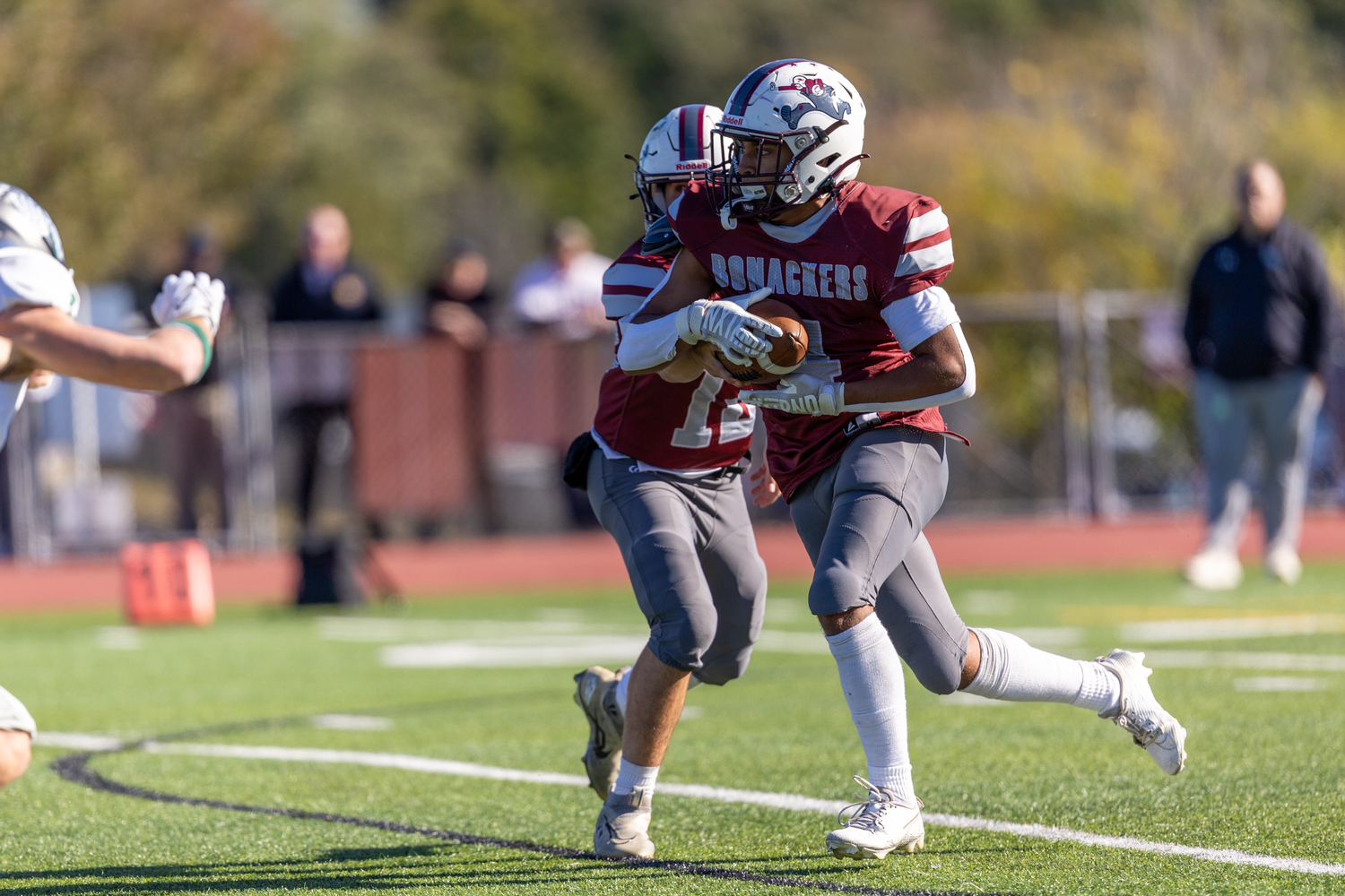 Bridgehampton junior running back Alex Davis takes a handoff from East Hampton junior quarterback Theo Ball.   RON ESPOSITO