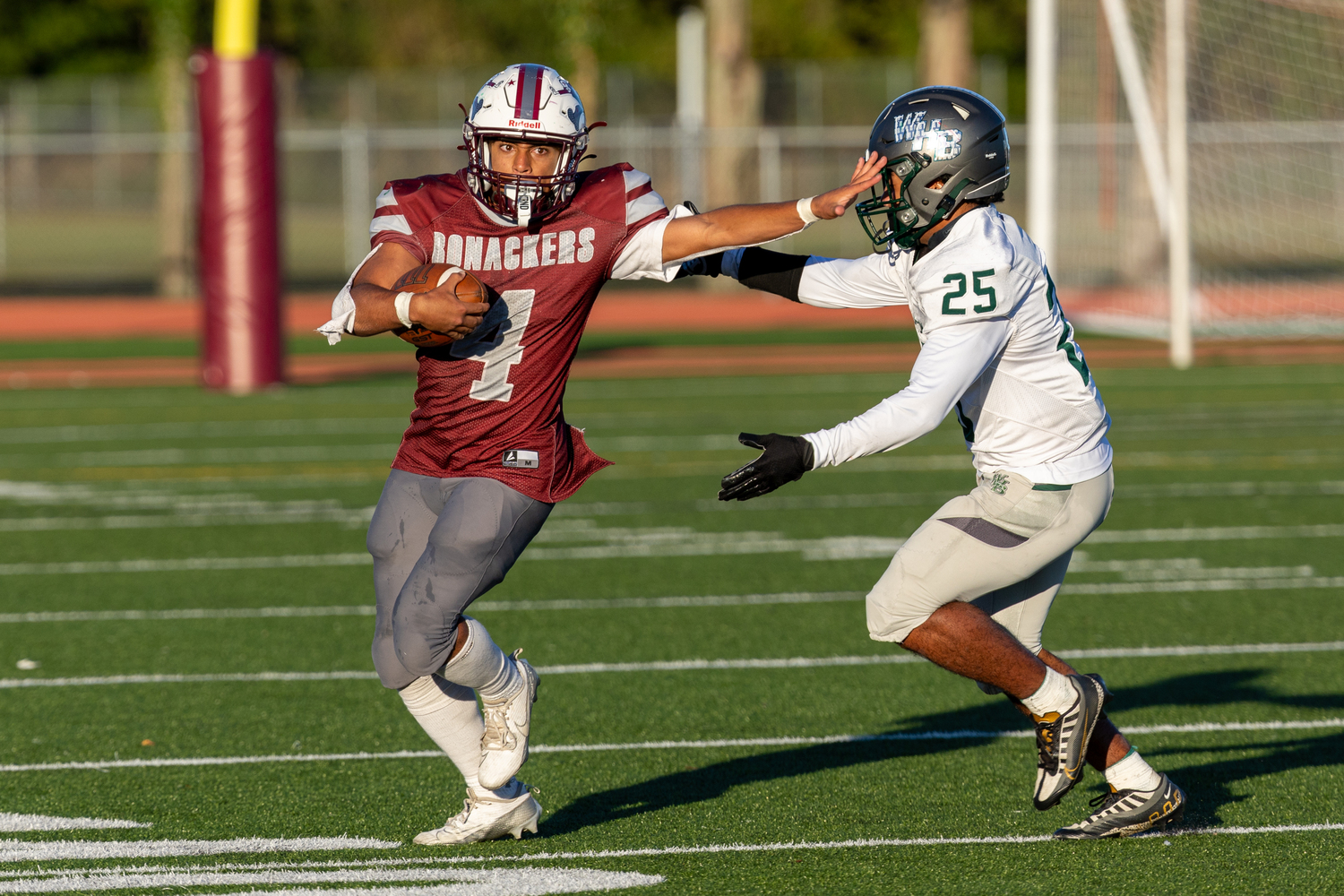 Bridgehampton junior Alex Davis stiff arms a Westhampton Beach defender.   RON ESPOSITO