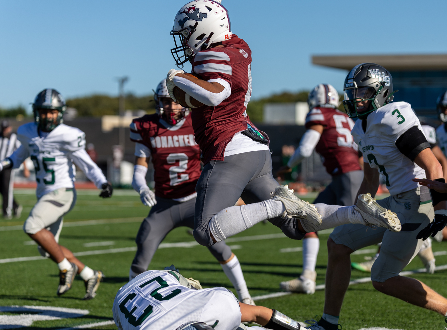 Bridgehampton junior Alex Davis leaps over a diving Westhampton Beach player.   RON ESPOSITO