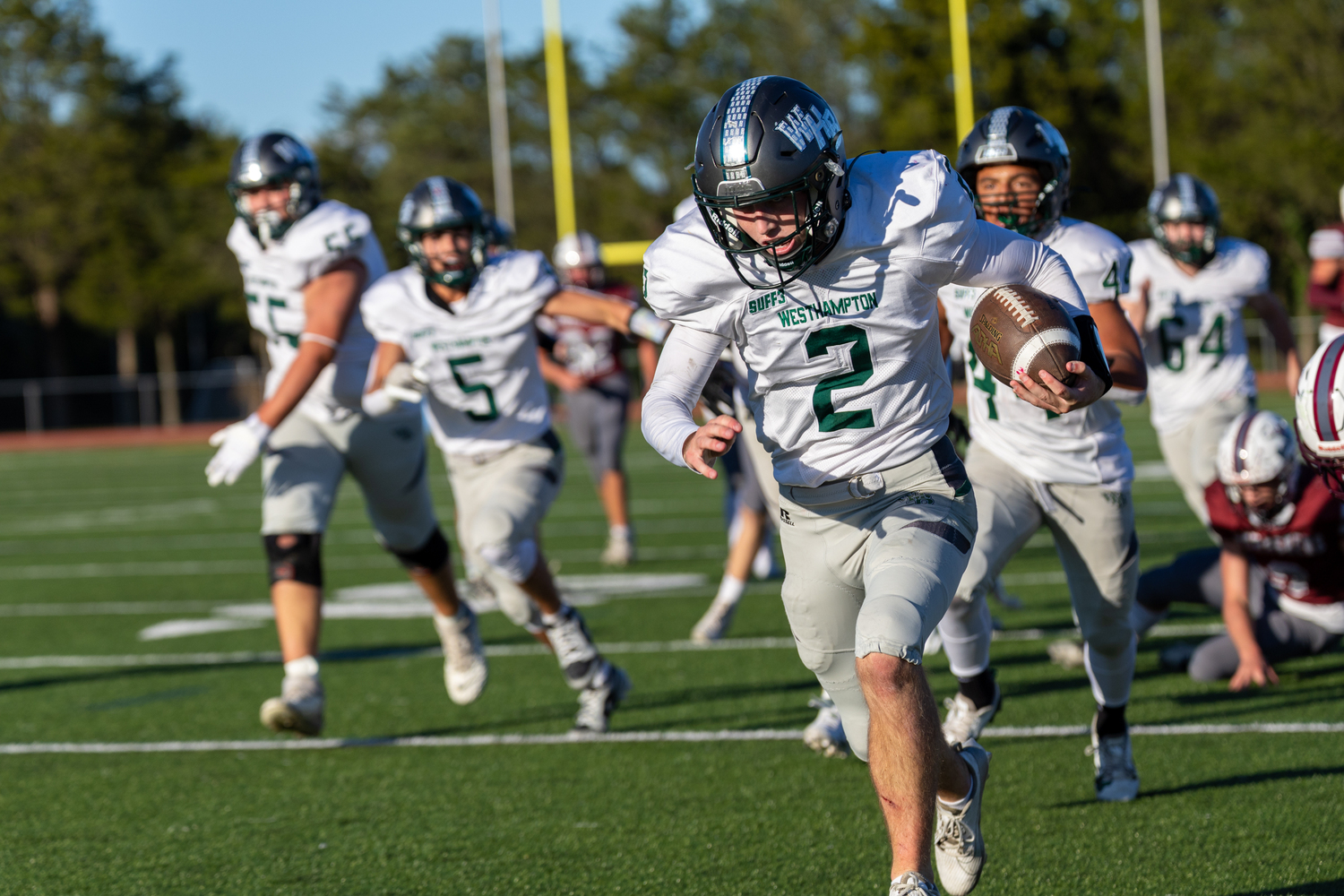 Westhampton Beach senior Finn Drake continues to run after breaking tackles and scores in the third quarter.   RON ESPOSITO