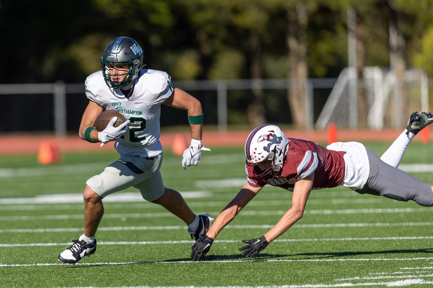 Westhampton Beach senior Brody Schaffer alludes a Bonac tackler.   RON ESPOSITO