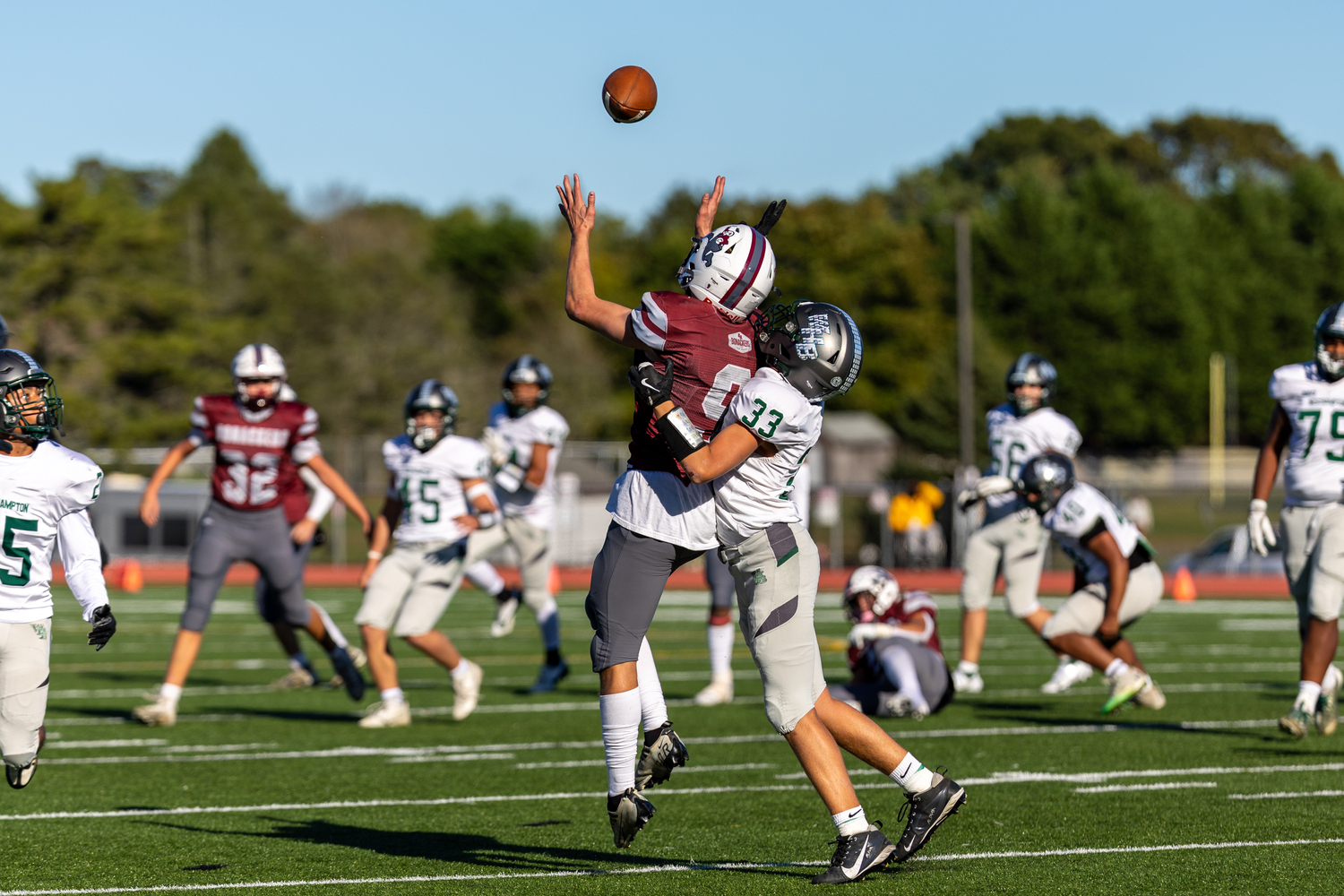 Charlie Stern goes up for a pass while being covered by Westhampton Beach senior Kyle Salerno, who was called for pass interference on the play.  RON ESPOSITO