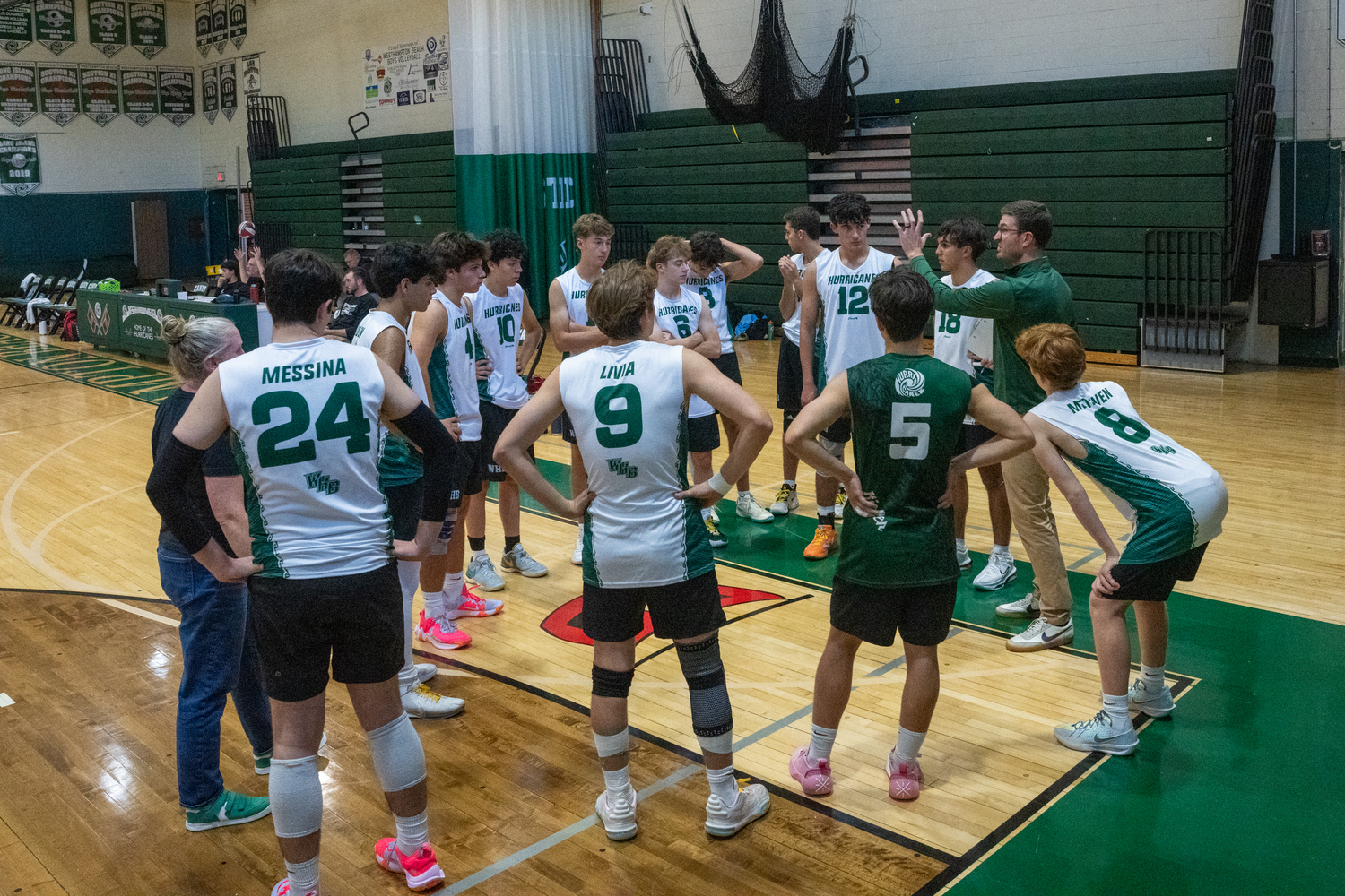 Westhampton Beach's boys volleyball team regroups after a first-set loss. RON ESPOSITO