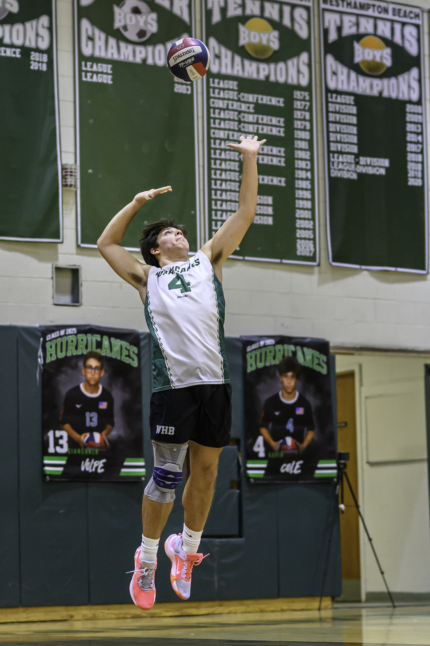 Senior setter Gavin Cole serves. MARIANNE BARNETT