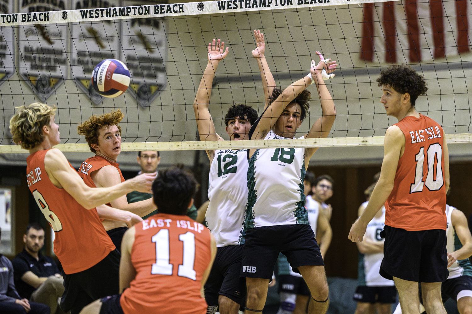 Junior right side Jude Allen and senior middle James Monserrate after making a block. MARIANNE BARNETT