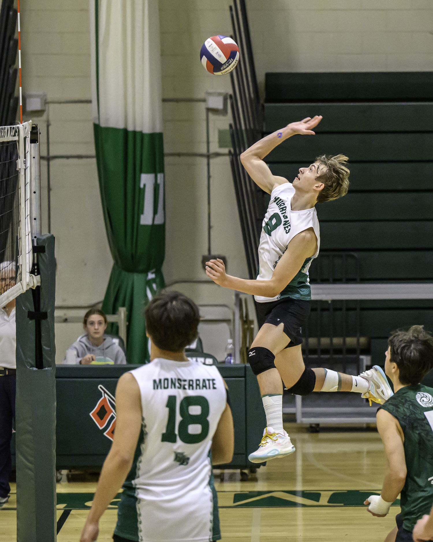 Junior outside hitter Thomas Livia spikes the ball. MARIANNE BARNETT