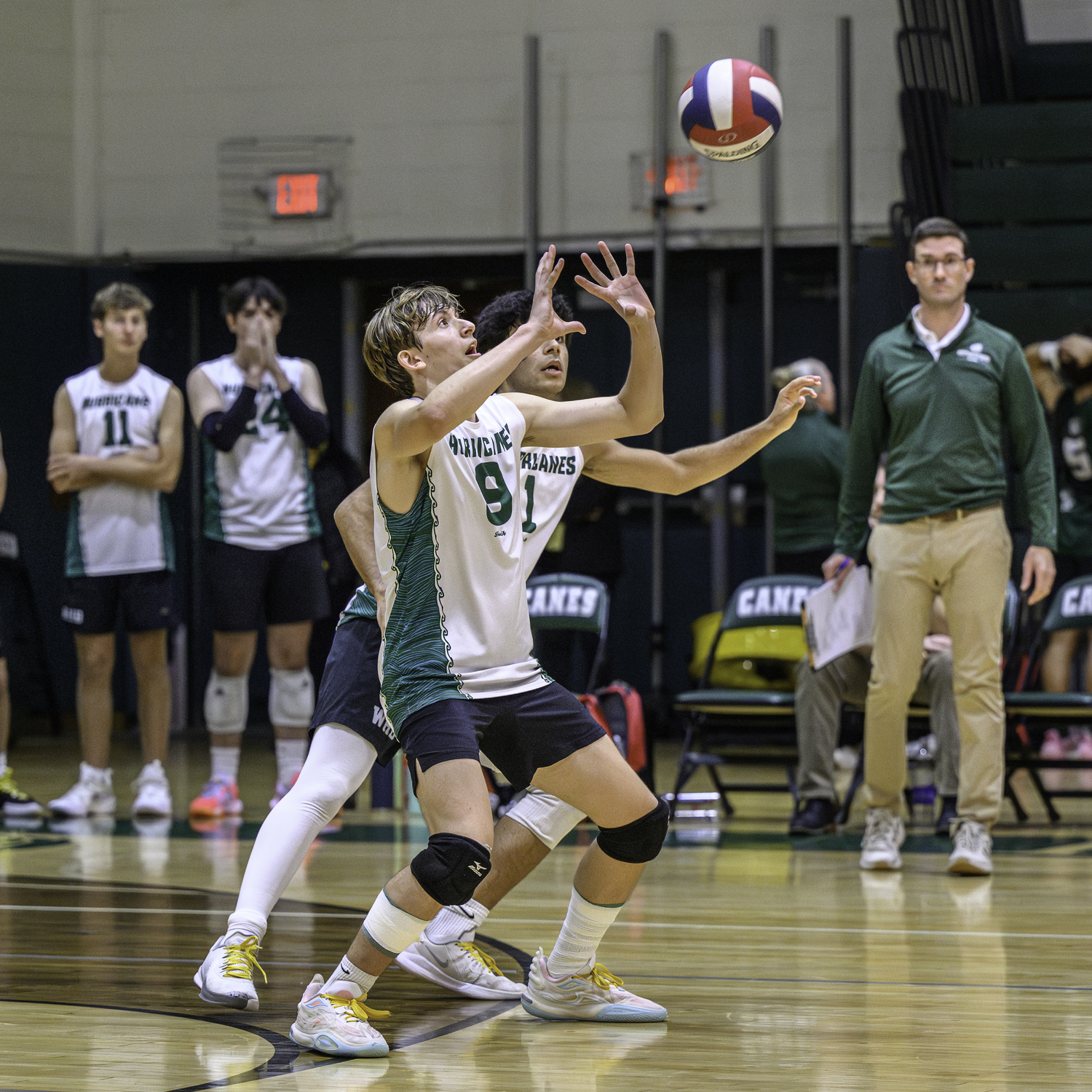 Junior outside hitter Thomas Livia makes a save. MARIANNE BARNETT