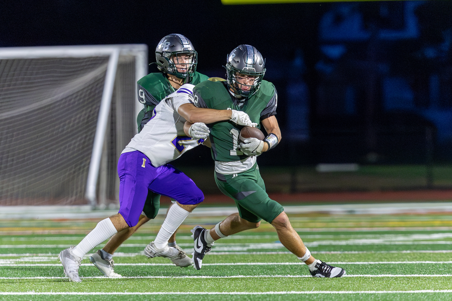 Senior running back Brody Schaffer carries a defender as he moves up the field. RON ESPOSITO